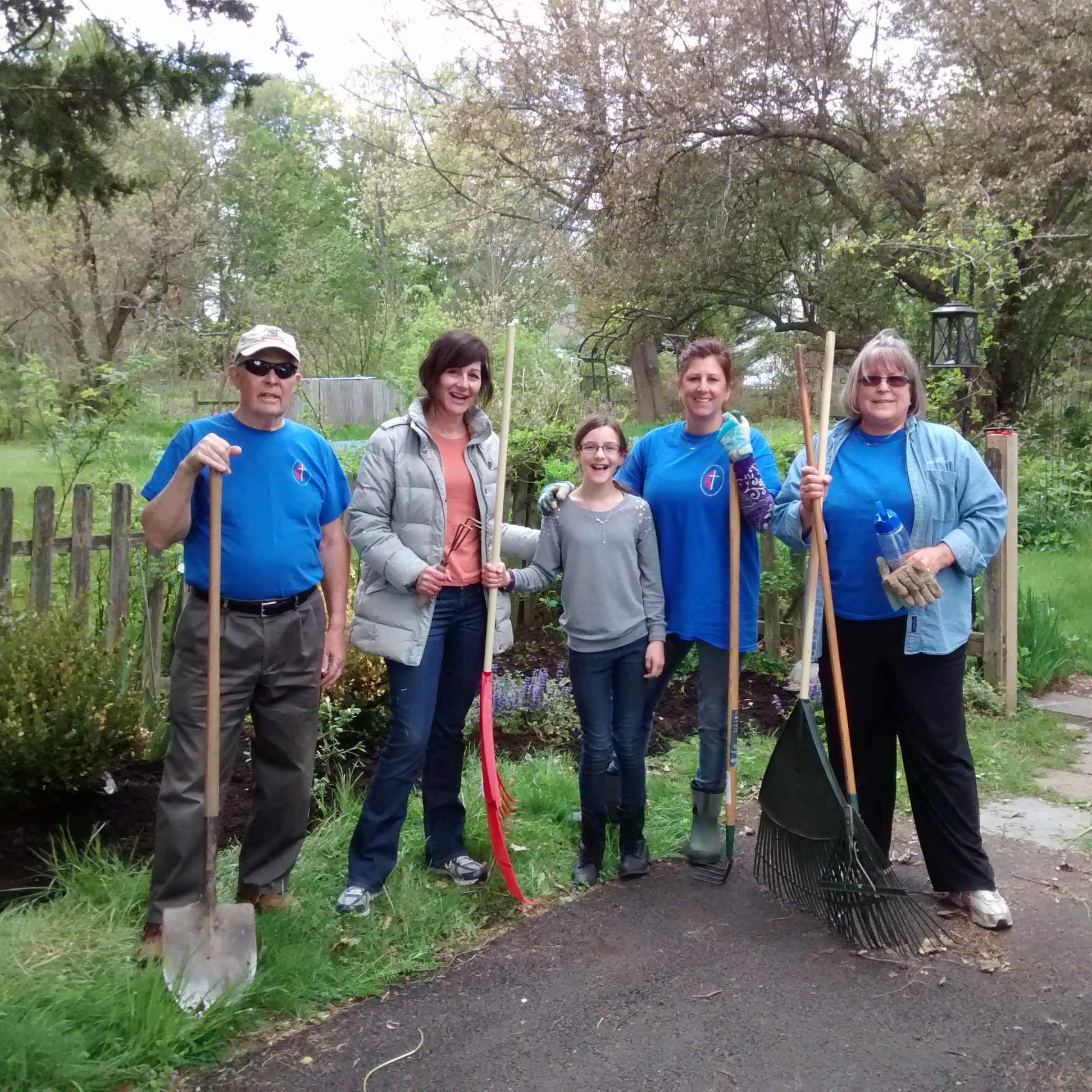 Church members with rakes and shovels