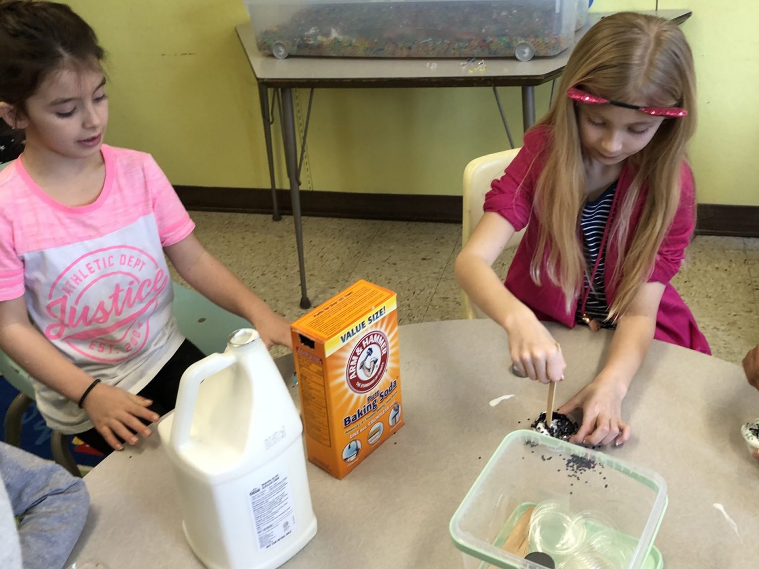 Two girls doing a craft project