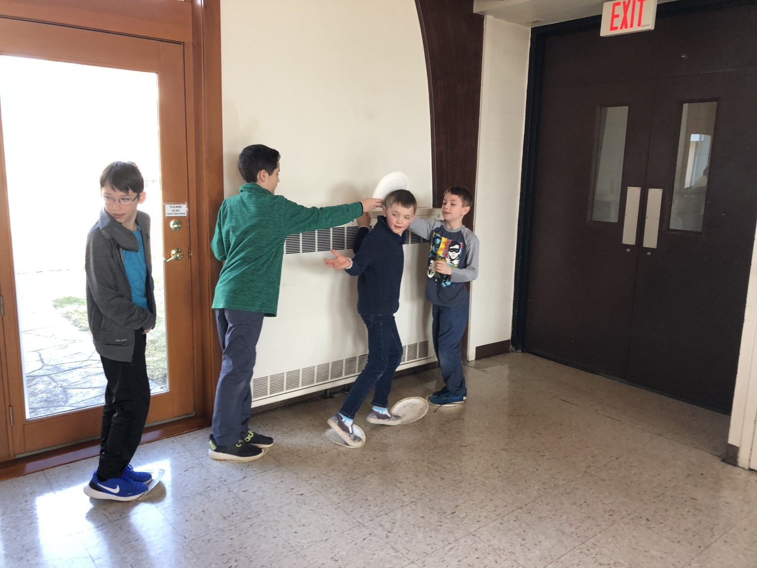 Four boys playing a game