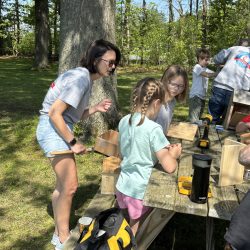 Youth making birdhouses
