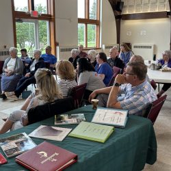 People attending the conversation with George Herrick and Cynthia Becker in the Fellowship Hall